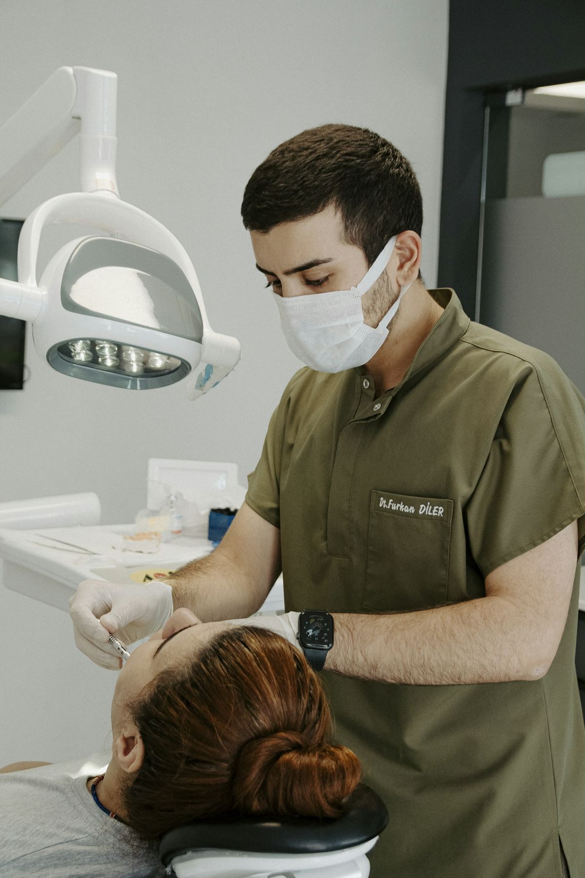 Dentist with a patient in a calm, modern treatment room
